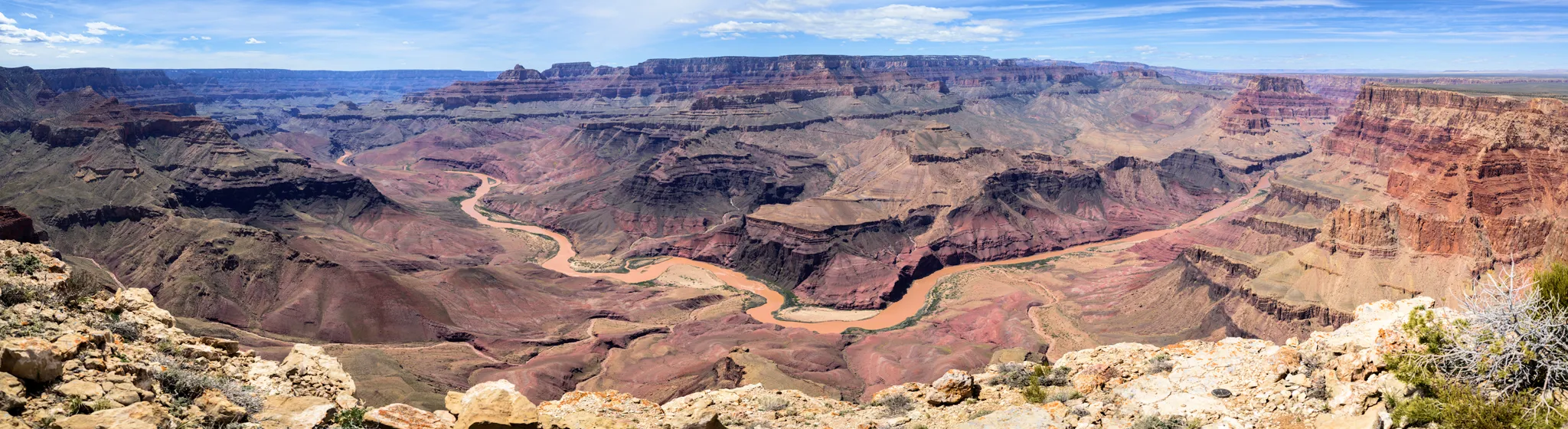 A view of Beyond the Rim: Cross-Country to Comanche Point featuring Colorado River in Grand Canyon National Park, AZ on the Cape Solitude Trail at midday in Spring.