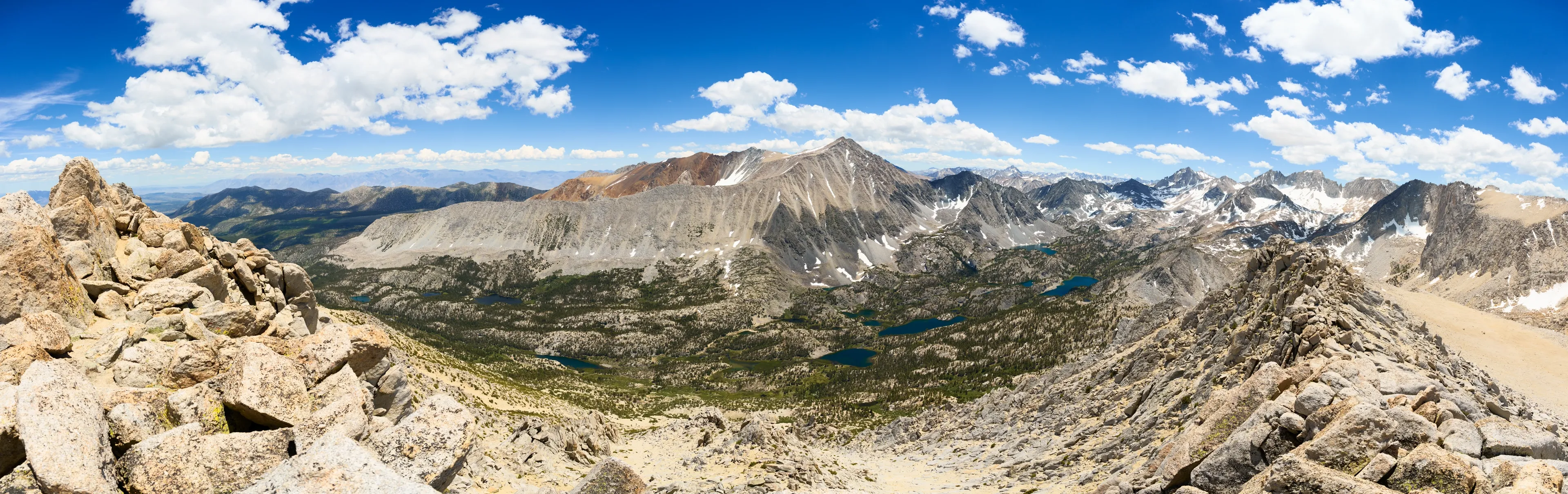 A view of Little Lakes Valley from Mount Starr in Inyo National Forest, CA on the Mono Pass Trail at midday in Summer.
